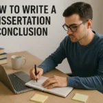 Student writing a dissertation conclusion with notes and laptop