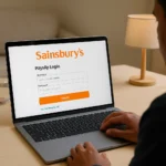 Sainsbury’s employee payslip login portal on laptop